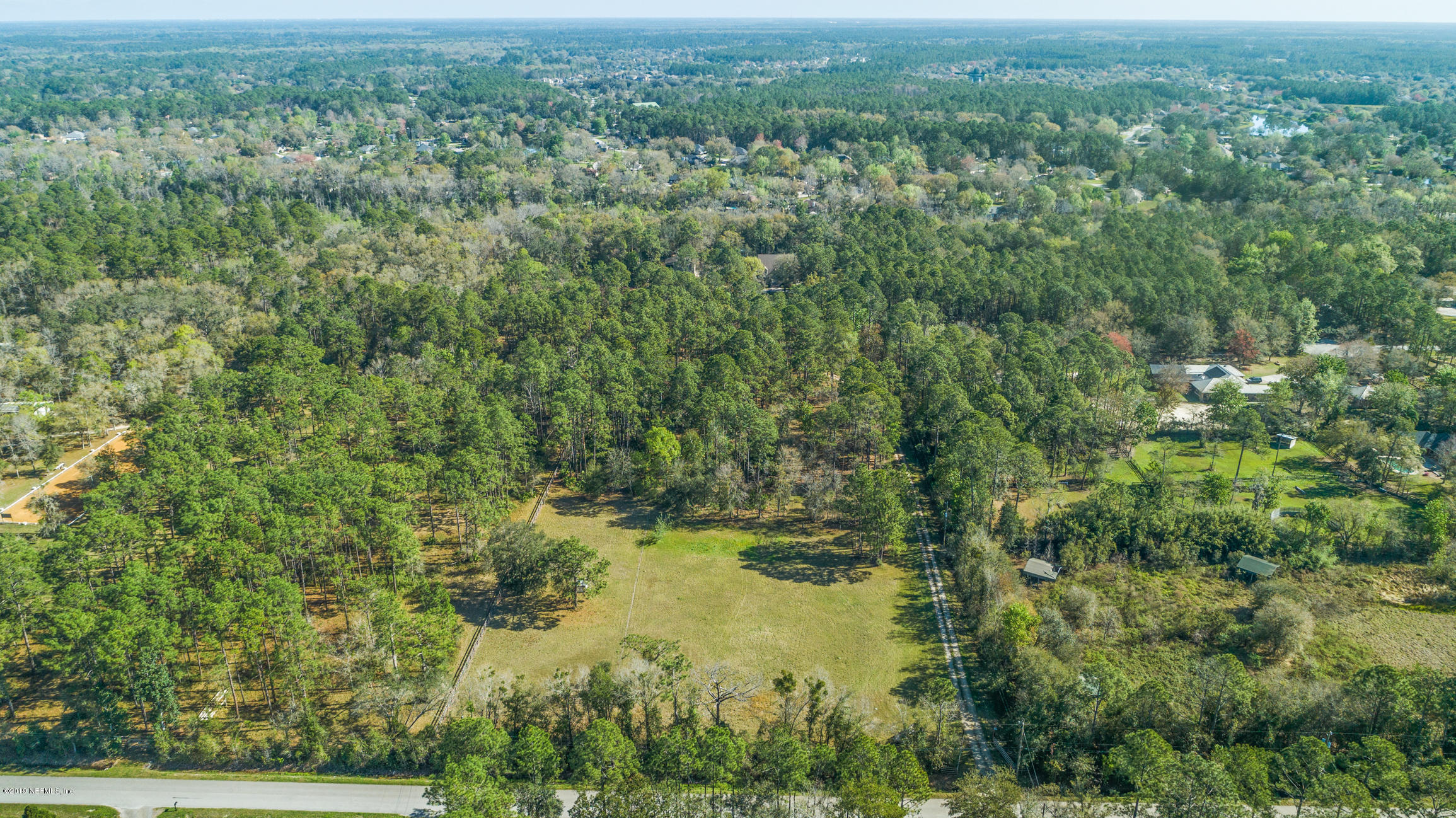 1435 Scott Road St. Johns, FL 32259 - Photo 65 of 65 an aerial view of residential houses with outdoor space and trees