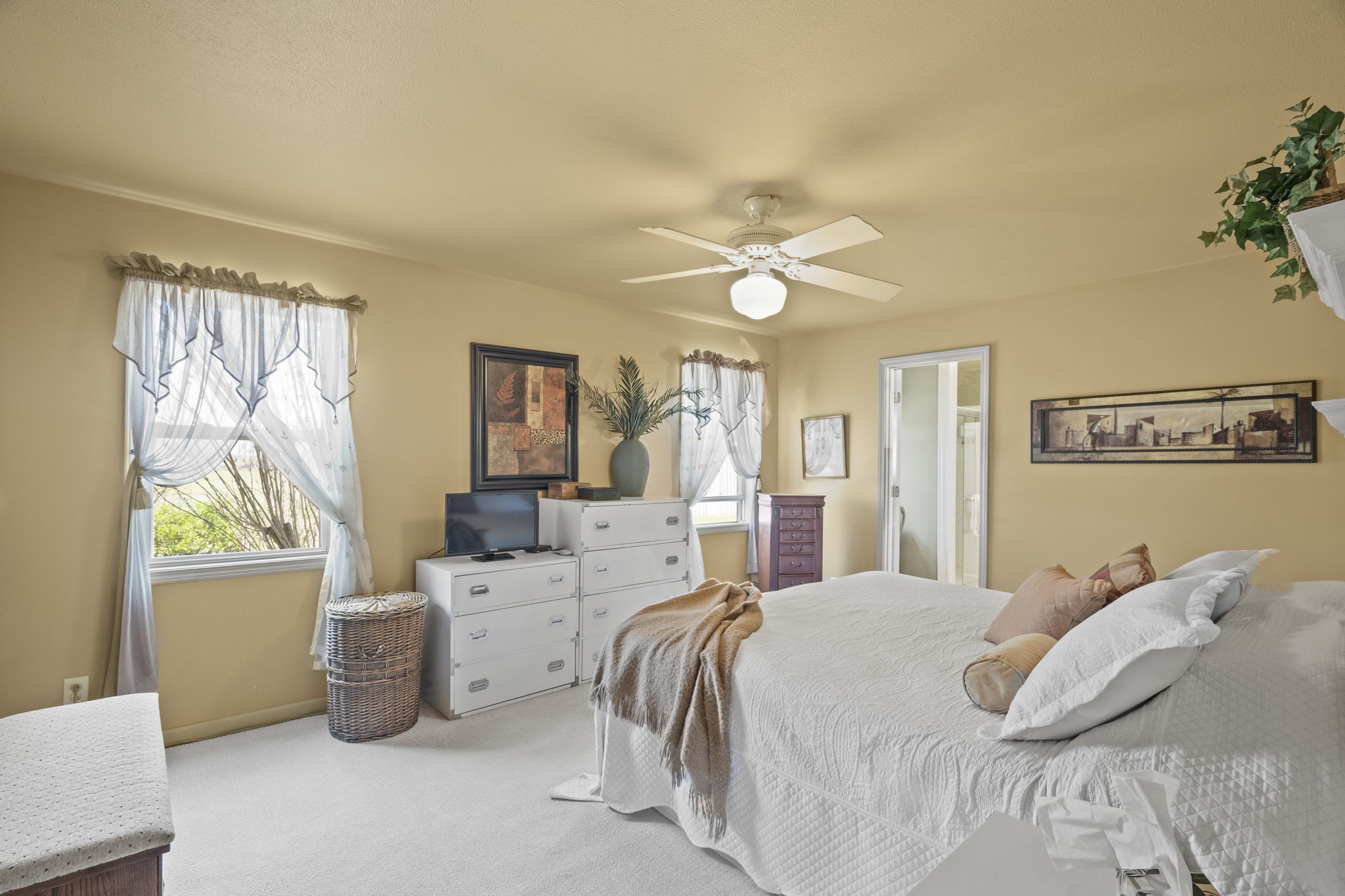 4760 Barren Plains Road Springfield, TN 37172 - Photo 20 of 47 a bedroom with a bed and a chandelier