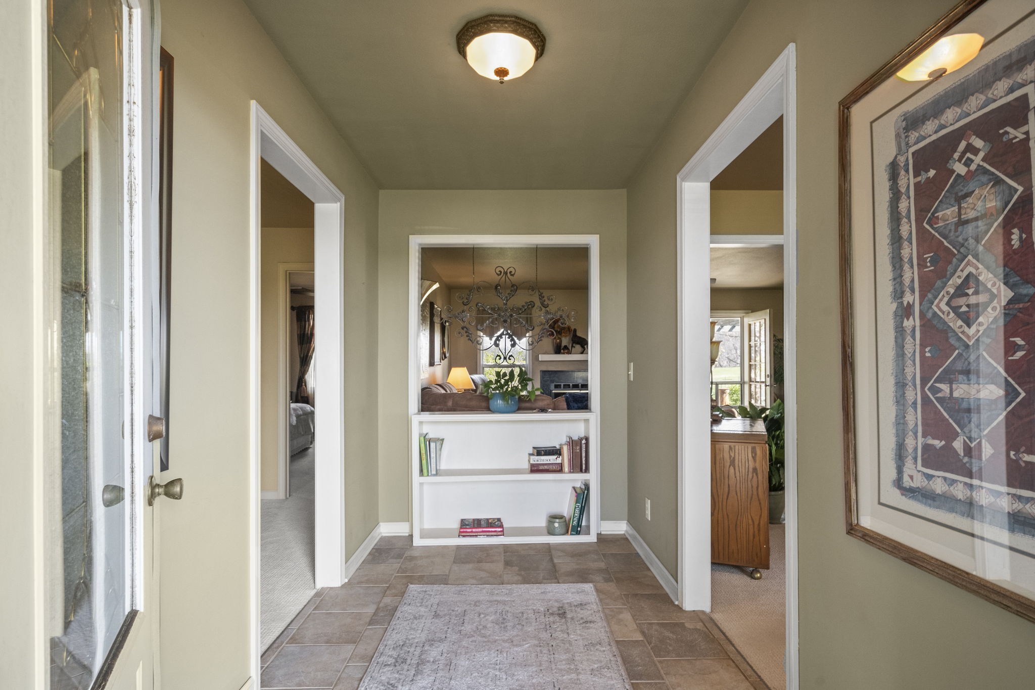 4760 Barren Plains Road Springfield, TN 37172 - Photo 24 of 47 a view of a hallway with wooden floor and a livingroom