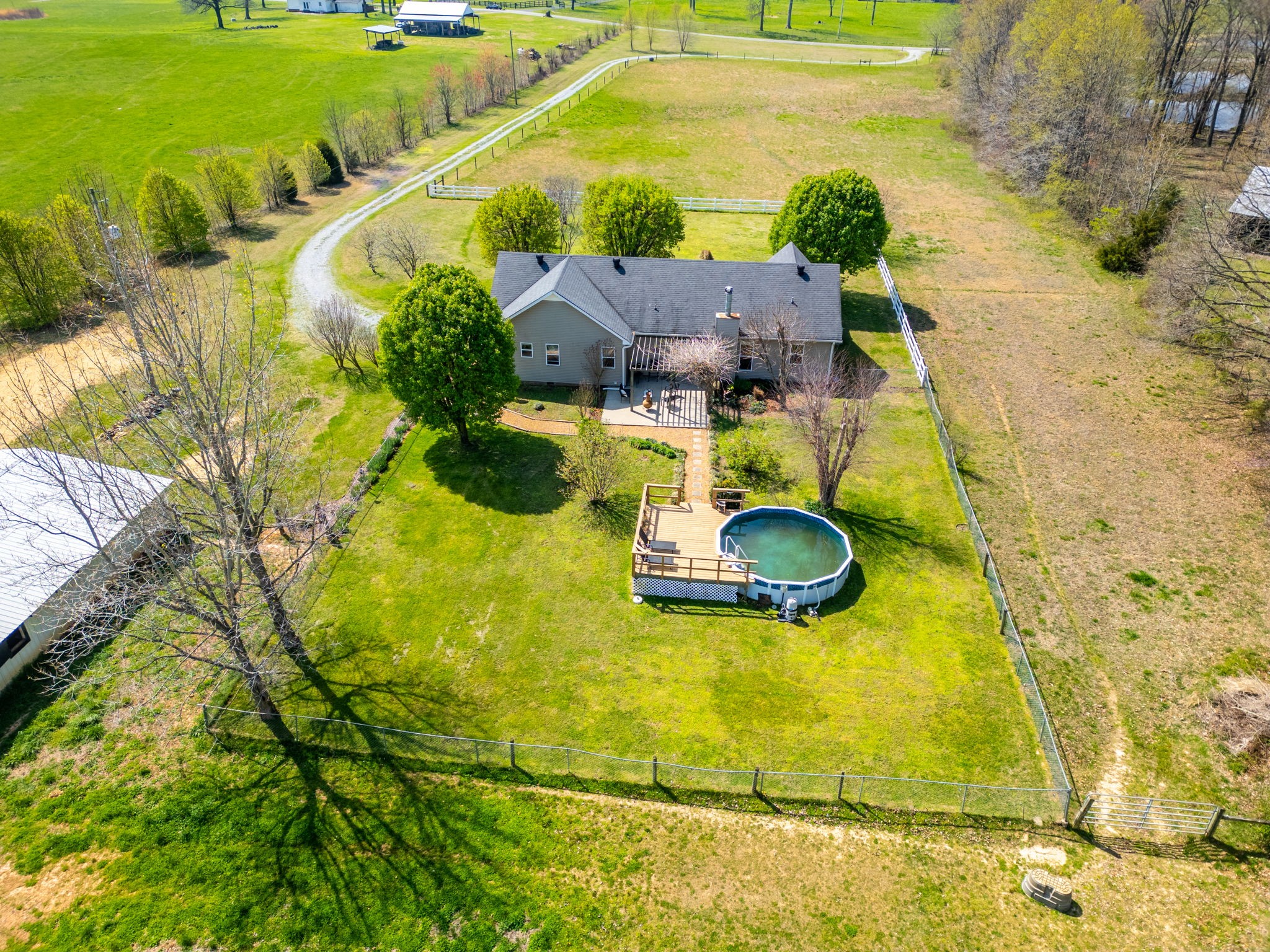 4760 Barren Plains Road Springfield, TN 37172 - Photo 37 of 47 a swimming pool with some tall trees