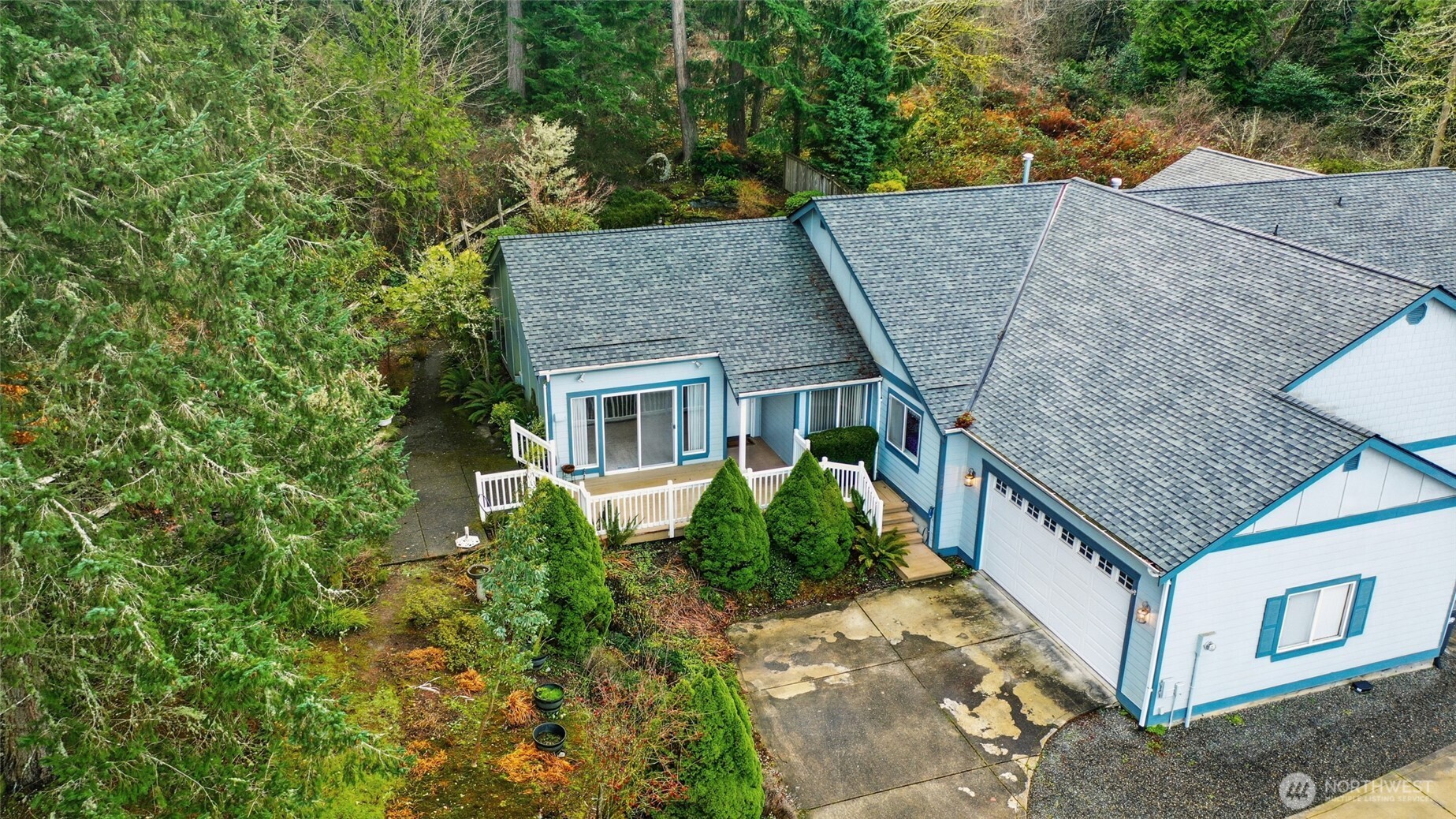a aerial view of a house with a yard