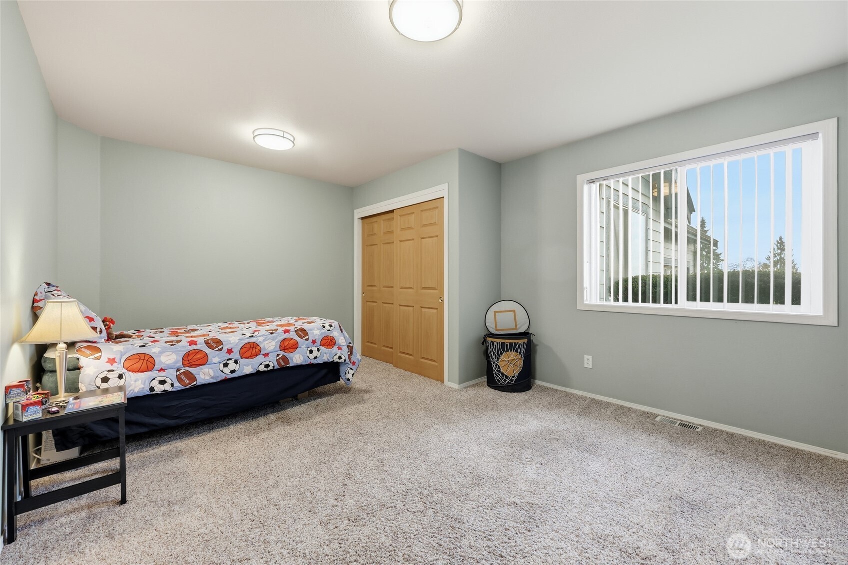 1083 5th Street Steilacoom, WA 98388 - Photo 13 of 39 a bedroom with furniture and a window