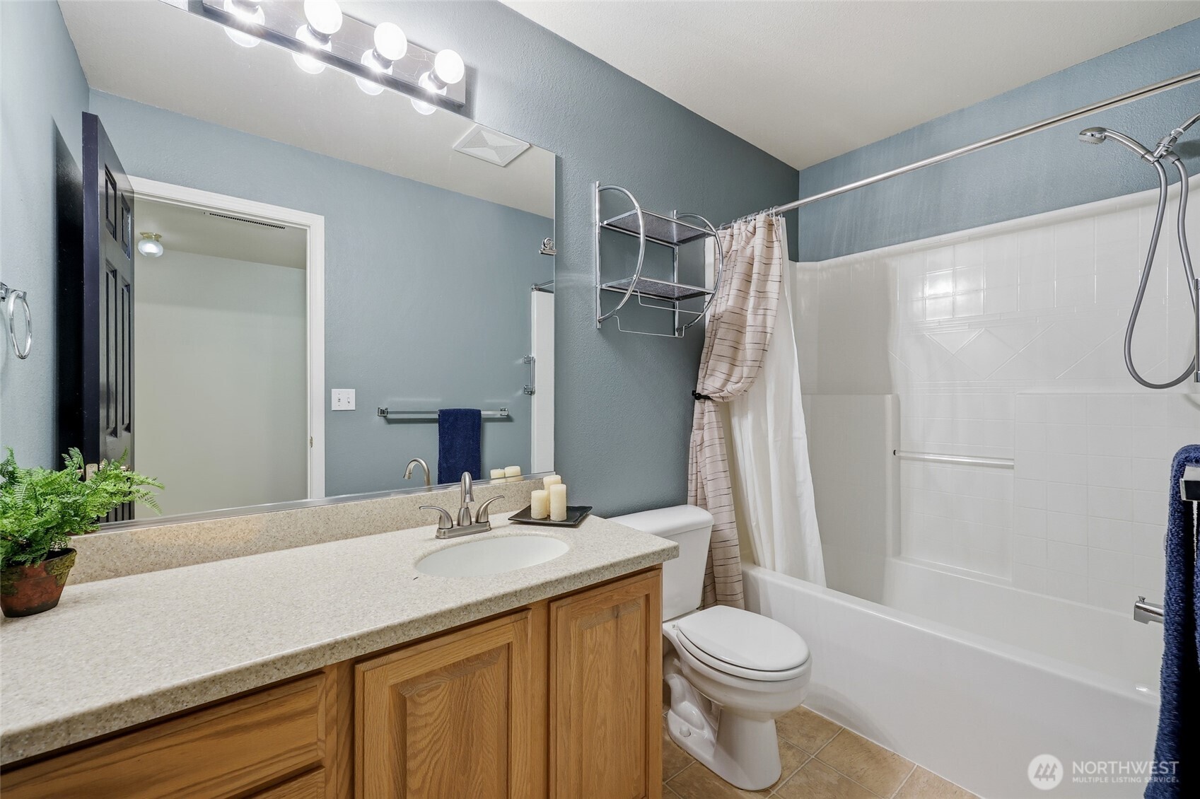 1083 5th Street Steilacoom, WA 98388 - Photo 16 of 39 a bathroom with a sink toilet and shower