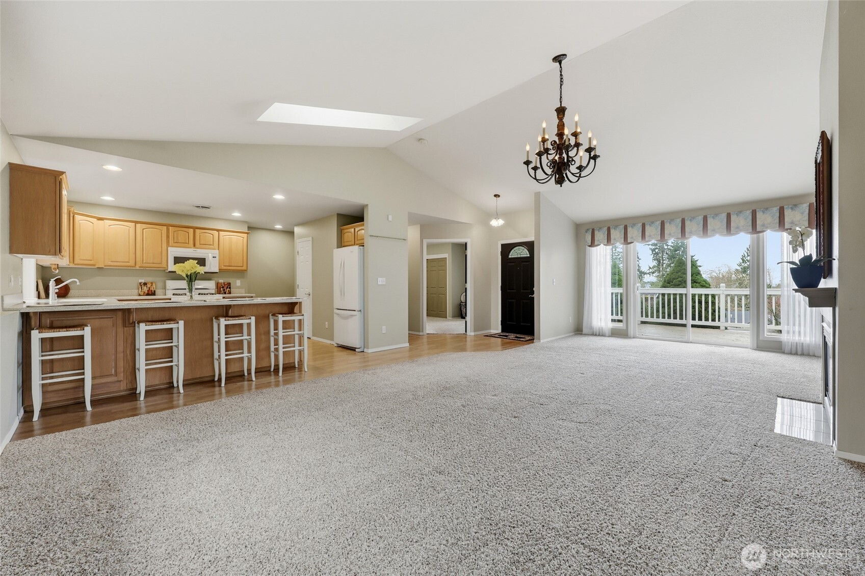 1083 5th Street Steilacoom, WA 98388 - Photo 3 of 39 a view of a kitchen with granite countertop a refrigerator and a sink