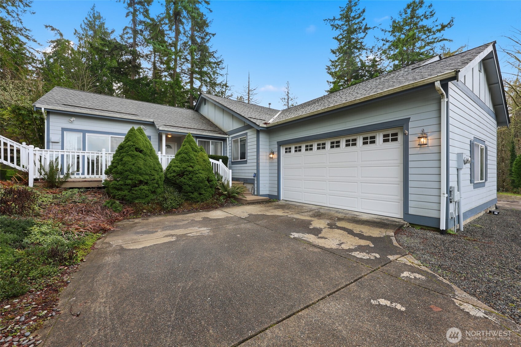 1083 5th Street Steilacoom, WA 98388 - Photo 32 of 39 a front view of a house with a yard and garage