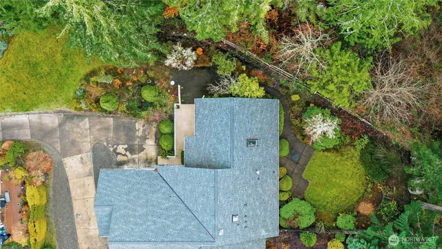 an aerial view of a house having yard