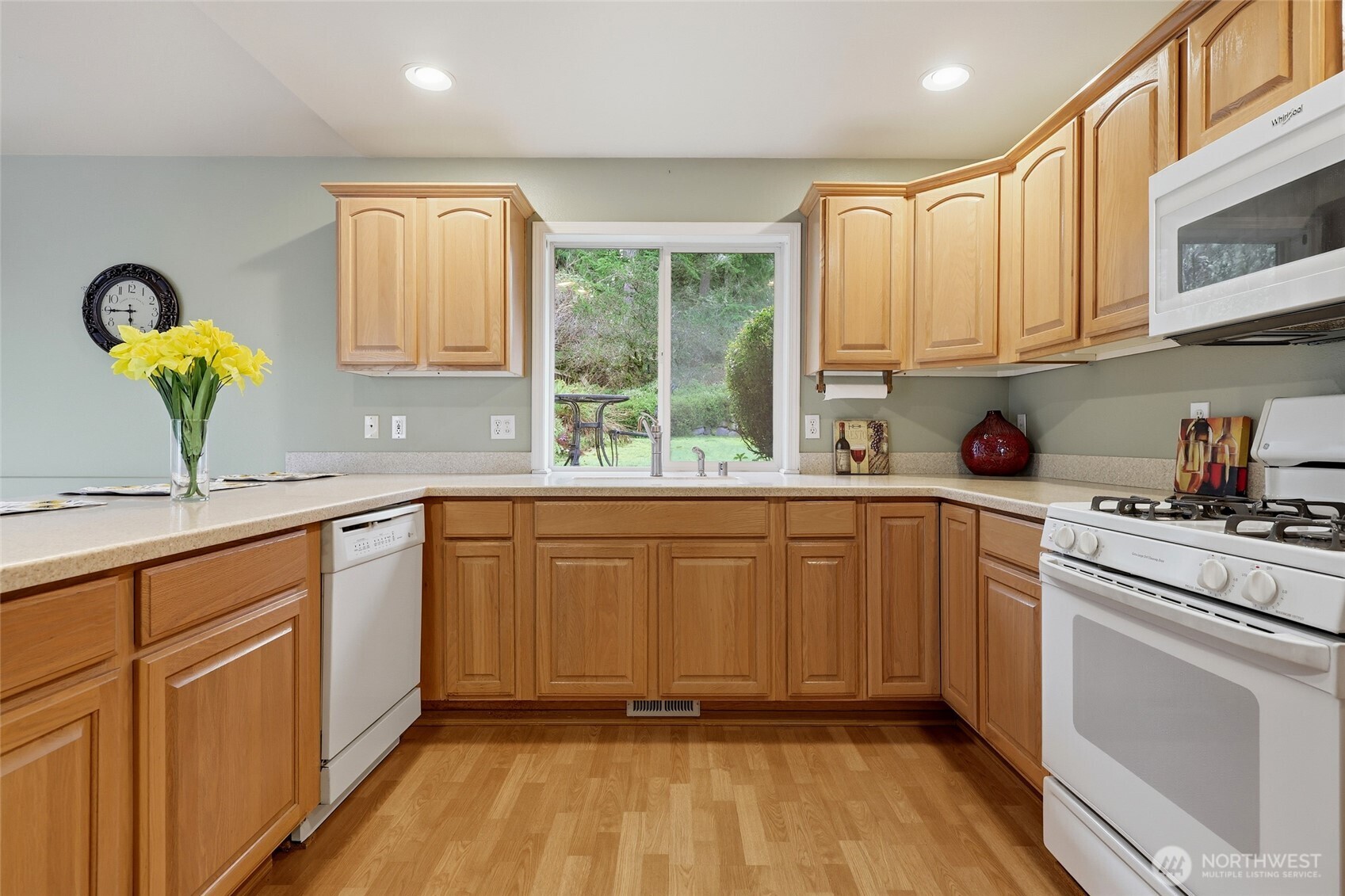 1083 5th Street Steilacoom, WA 98388 - Photo 7 of 39 a kitchen with a sink cabinets and window