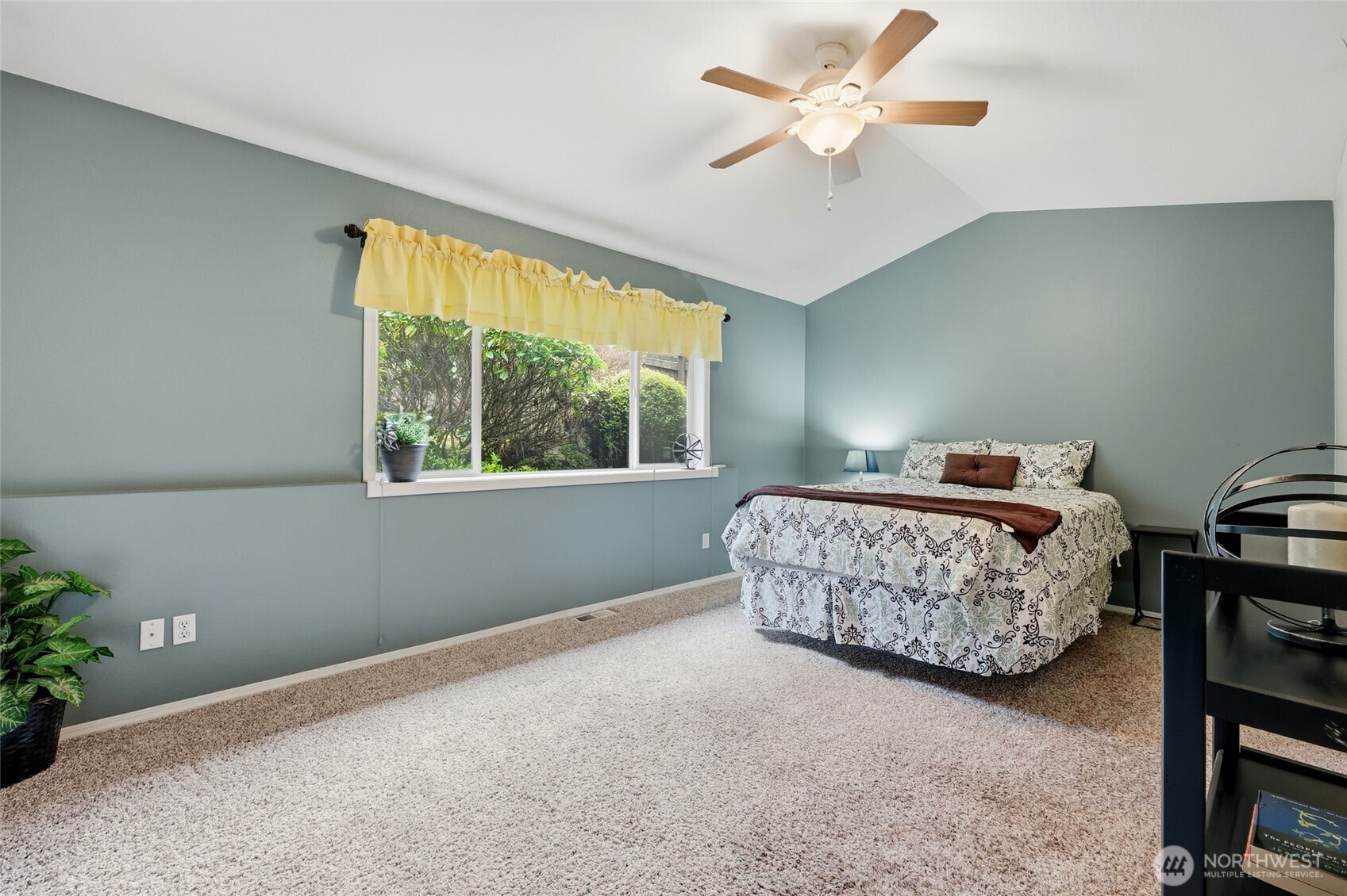 1083 5th Street Steilacoom, WA 98388 - Photo 10 of 39 a bedroom with a bed and a window