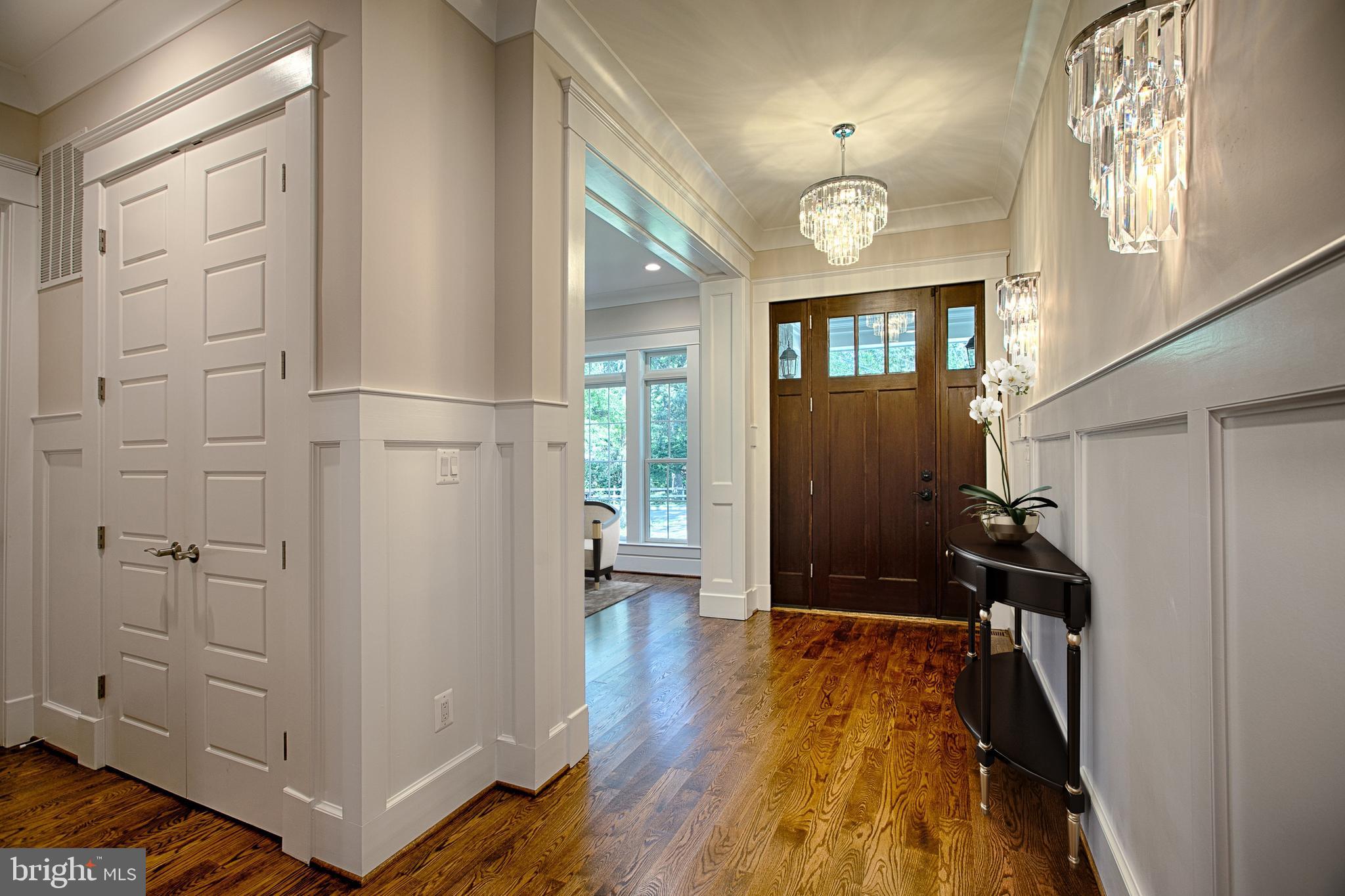 827 Ninovan Road Southeast Vienna, VA 22180 - Photo 2 of 30 Foyer entrance with moldings & sconce lighting