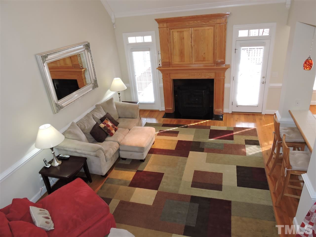 187 North Old Lantern Road Timberlake, NC 27583 - Photo 2 of 25 a living room with furniture a fireplace and a flat screen tv