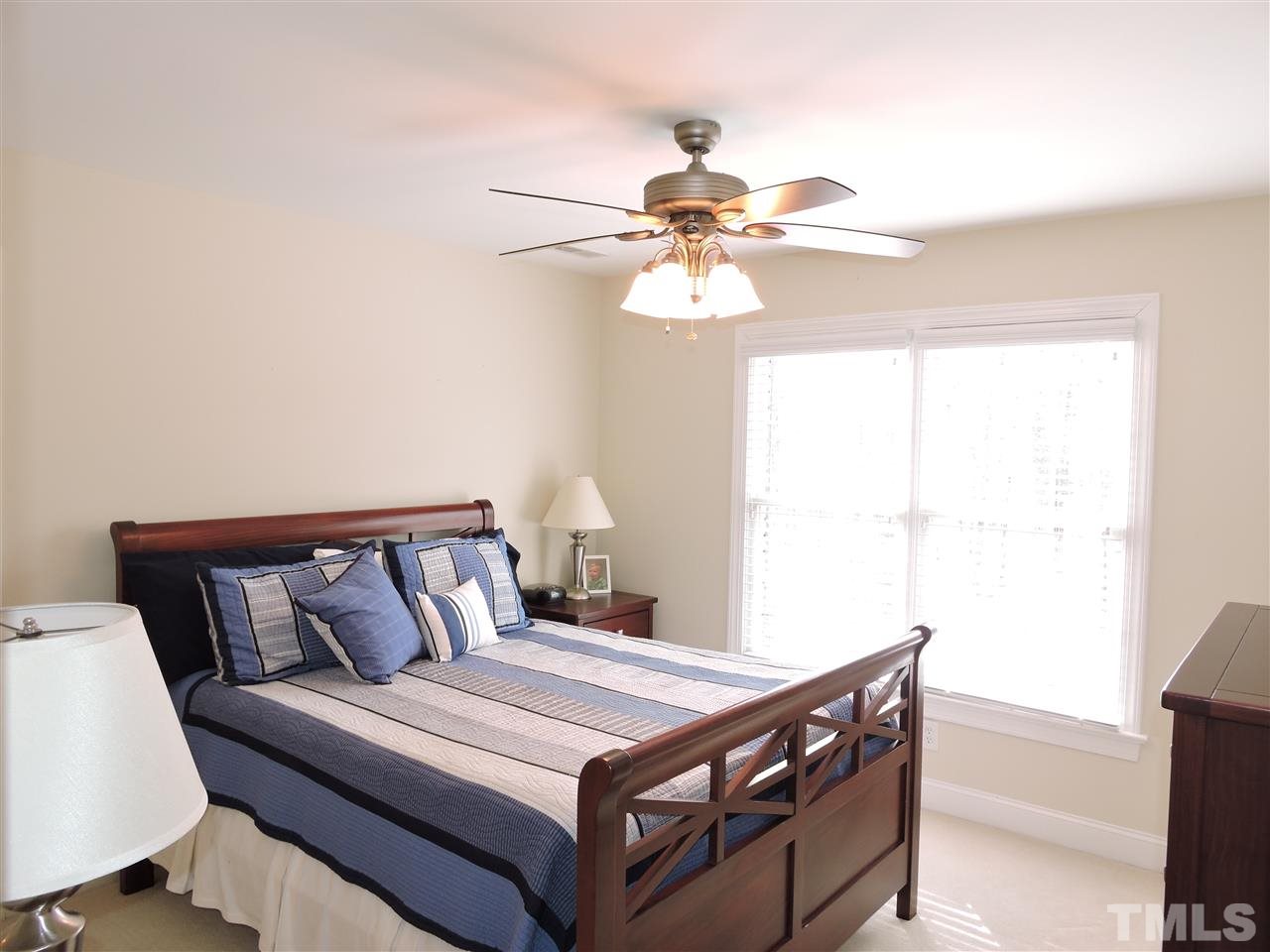 187 North Old Lantern Road Timberlake, NC 27583 - Photo 15 of 25 a bedroom with a bed and a ceiling fan
