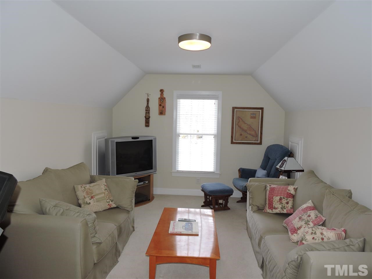 187 North Old Lantern Road Timberlake, NC 27583 - Photo 17 of 25 a living room with furniture and a flat screen tv