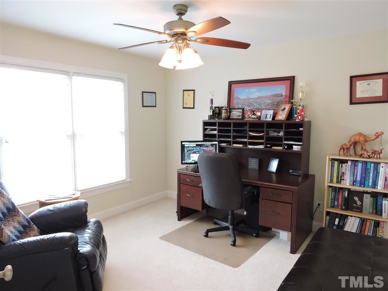 187 North Old Lantern Road Timberlake, NC 27583 - Photo 18 of 25 a view of a workspace with furniture and a window