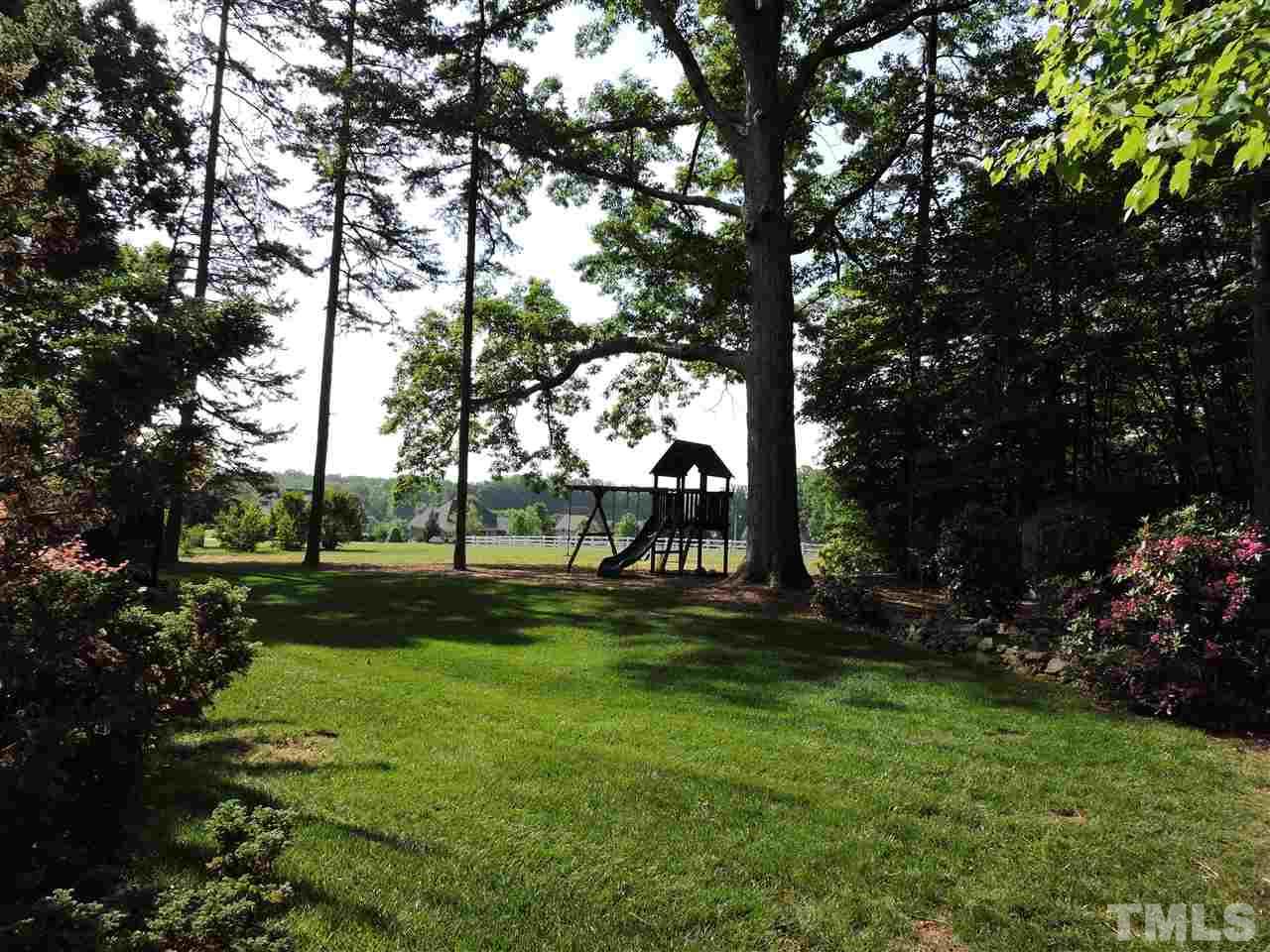 187 North Old Lantern Road Timberlake, NC 27583 - Photo 22 of 25 a view of a park with large trees