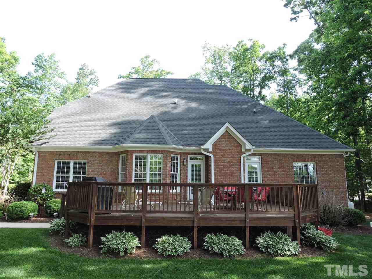 187 North Old Lantern Road Timberlake, NC 27583 - Photo 23 of 25 a view of a house with a deck and a yard