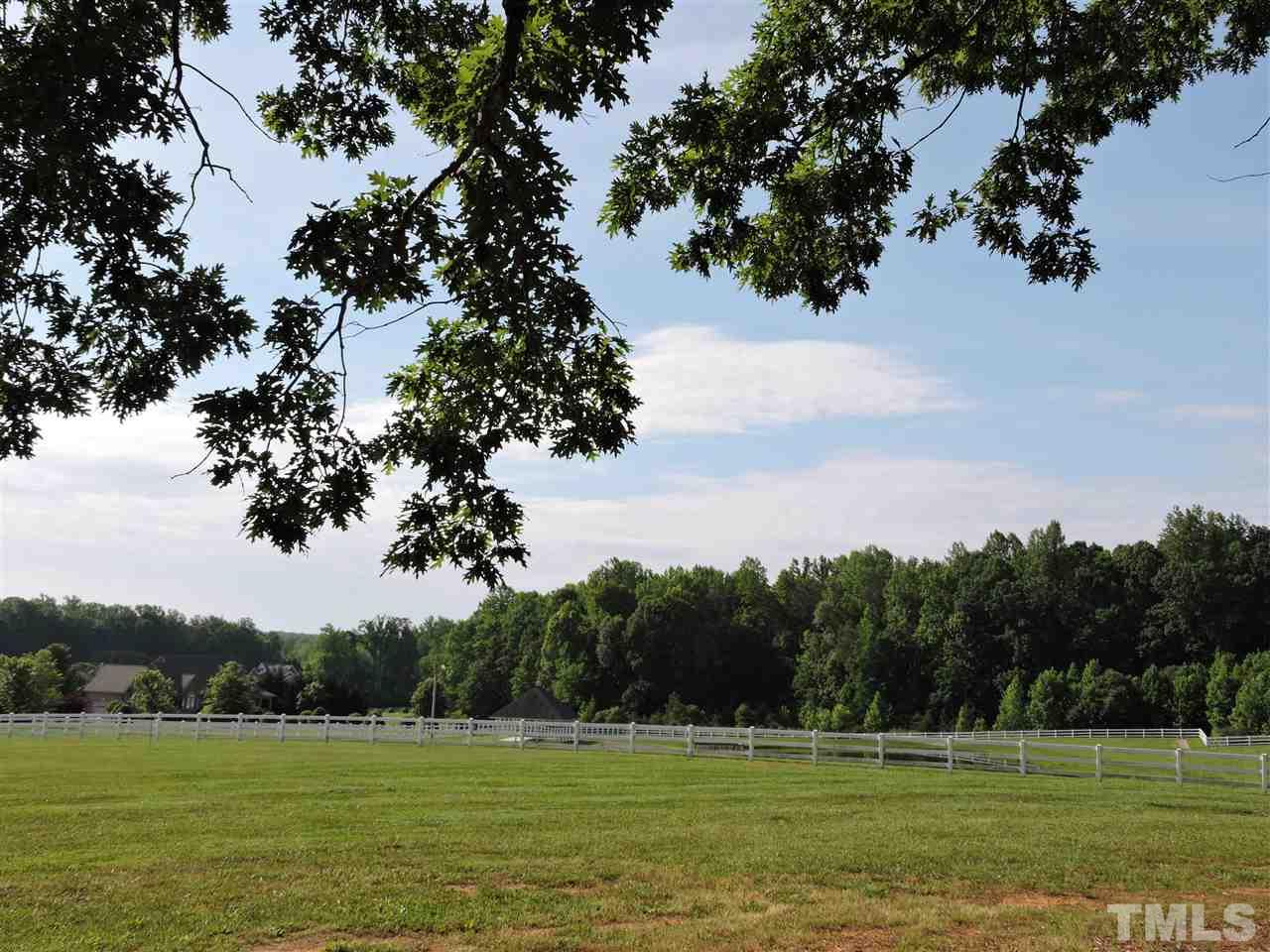 187 North Old Lantern Road Timberlake, NC 27583 - Photo 25 of 25 a view of a golf course with a lake view