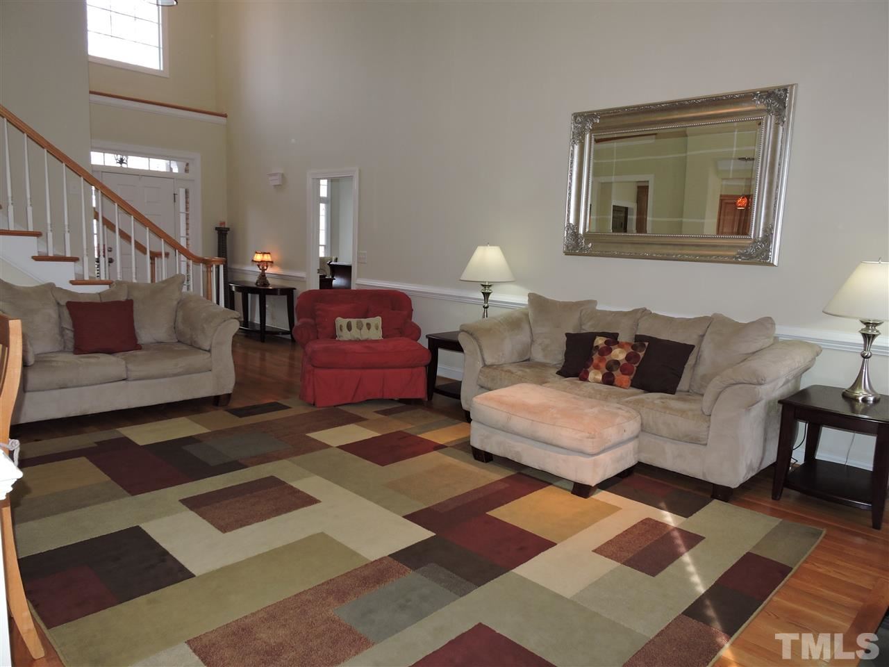 187 North Old Lantern Road Timberlake, NC 27583 - Photo 7 of 25 a living room with furniture and a rug