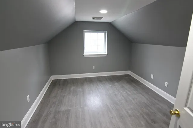 wooden floor and window in an empty room