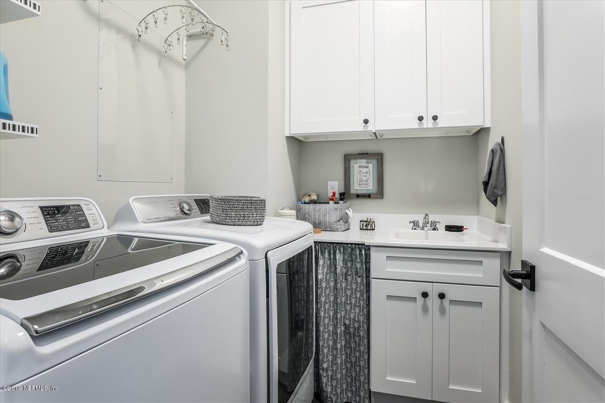 80 Ferrol Road St. Augustine, FL 32084 - Photo 13 of 32 a utility room with dryer and washer