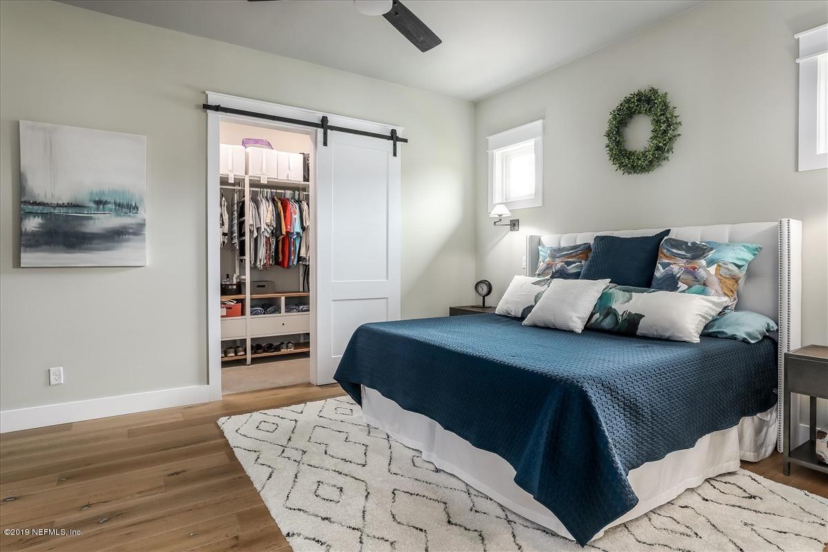 80 Ferrol Road St. Augustine, FL 32084 - Photo 14 of 32 a bedroom with a bed and wooden floor