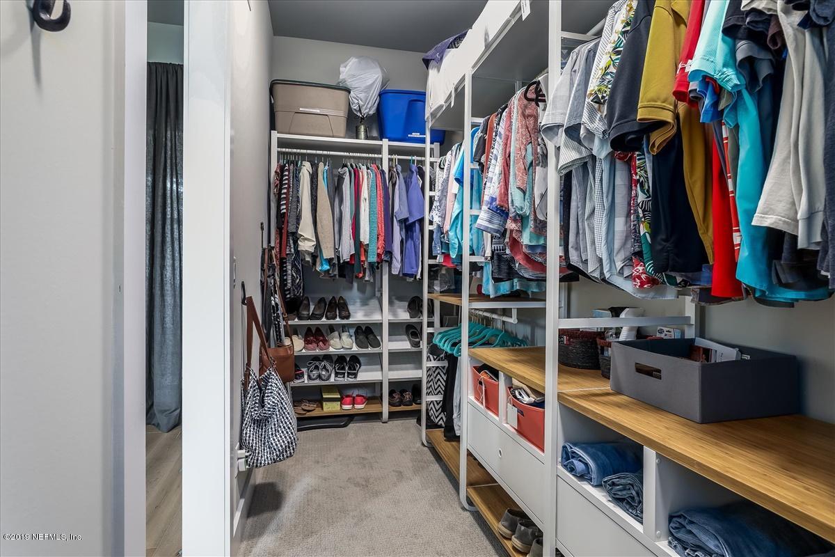 80 Ferrol Road St. Augustine, FL 32084 - Photo 16 of 32 a view of walk in closet with clothes and shoes