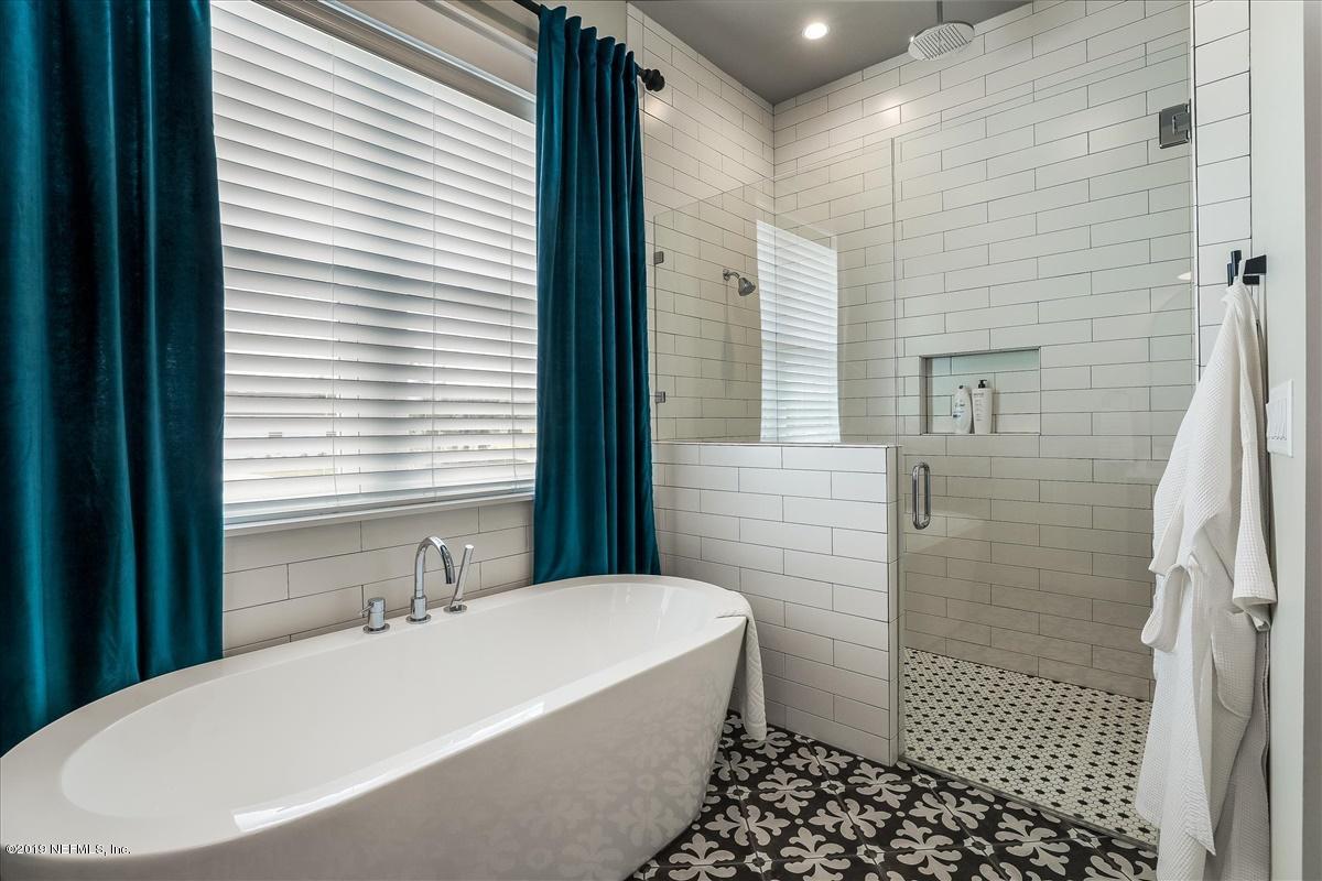 80 Ferrol Road St. Augustine, FL 32084 - Photo 18 of 32 a bathroom with a bathtub and shower