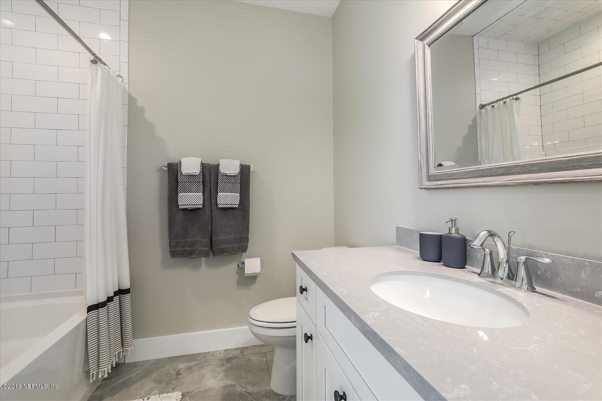 80 Ferrol Road St. Augustine, FL 32084 - Photo 20 of 32 a bathroom with a sink a toilet and shower