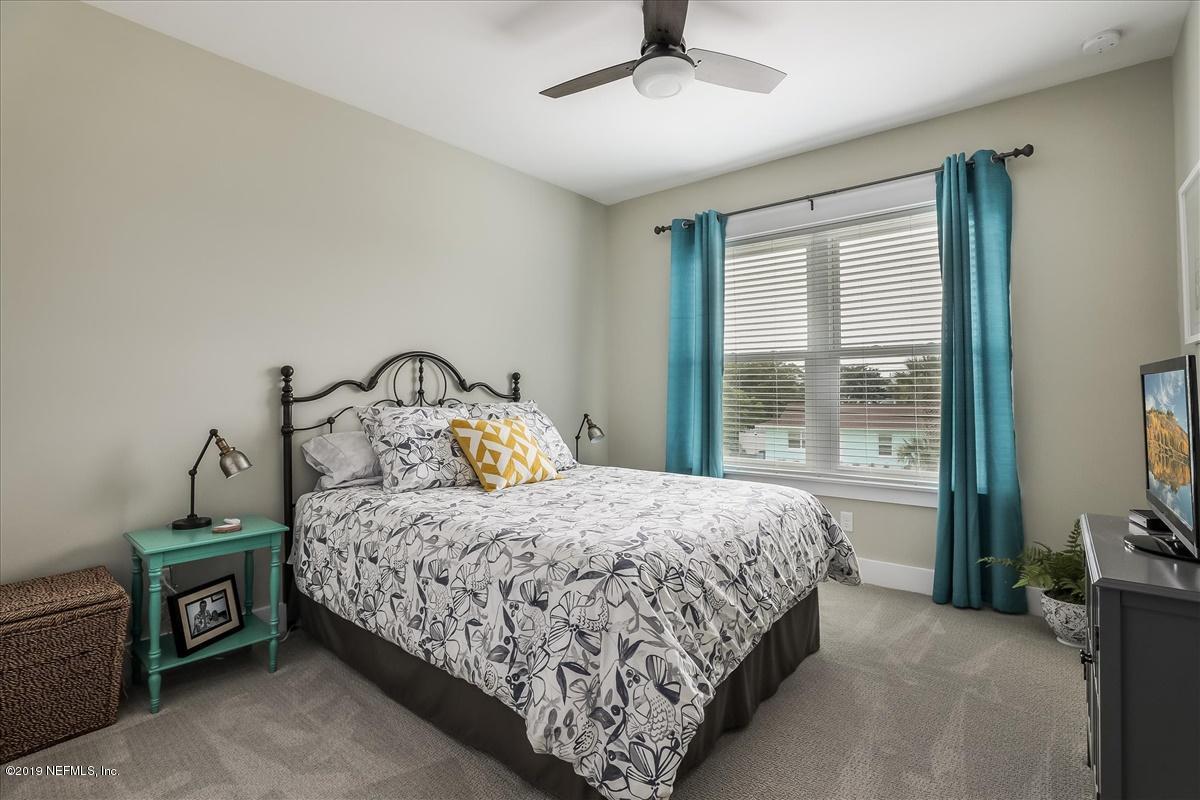 80 Ferrol Road St. Augustine, FL 32084 - Photo 21 of 32 a bedroom with a bed and a window