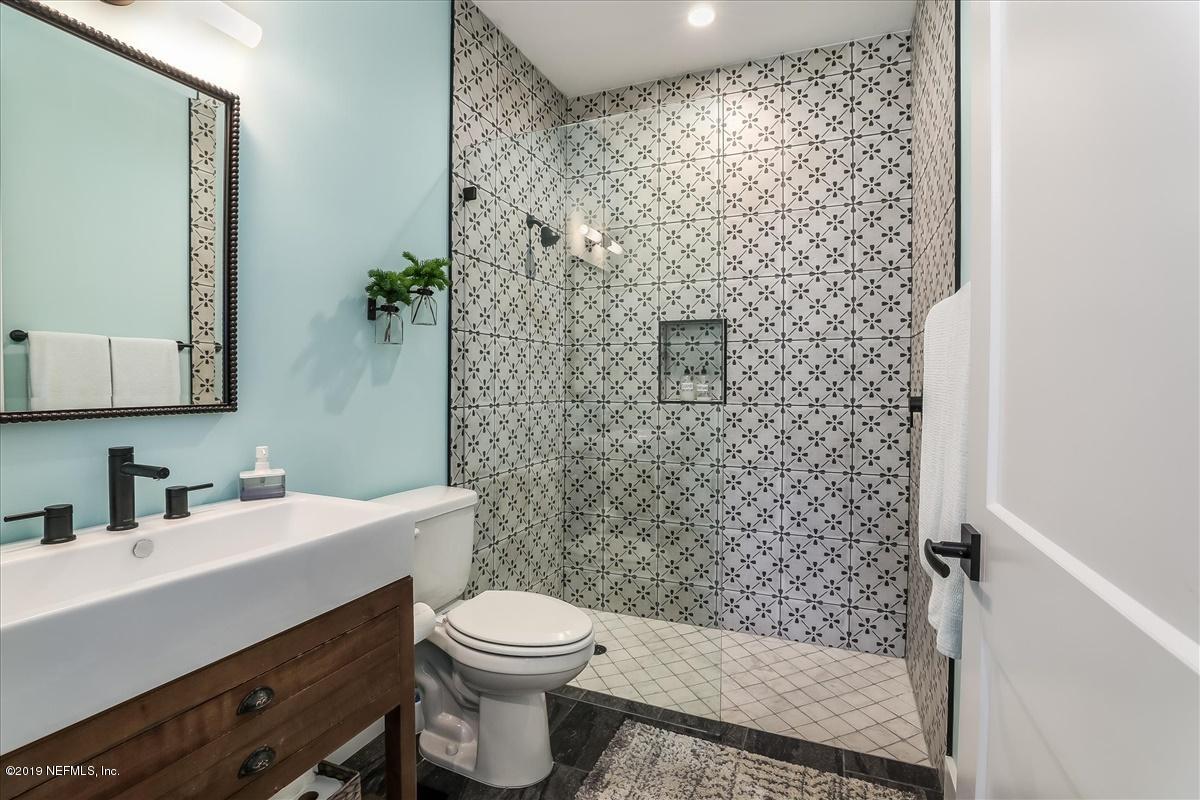 80 Ferrol Road St. Augustine, FL 32084 - Photo 23 of 32 a bathroom with a sink a toilet and shower