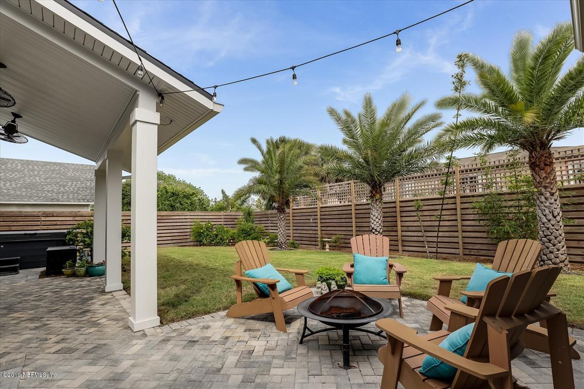 80 Ferrol Road St. Augustine, FL 32084 - Photo 25 of 32 a backyard of a house with table and chairs