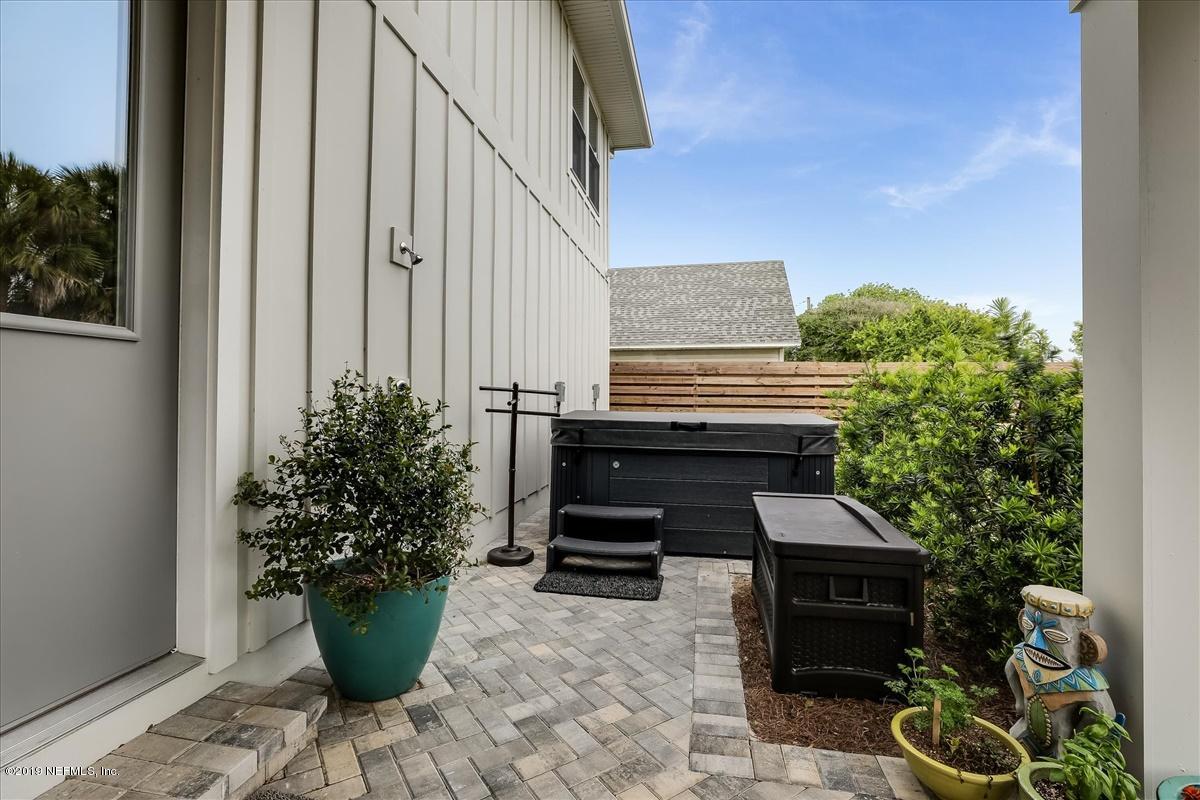 80 Ferrol Road St. Augustine, FL 32084 - Photo 26 of 32 a balcony with potted plants and a bench