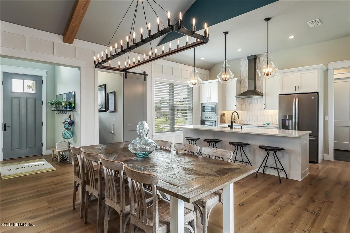 80 Ferrol Road St. Augustine, FL 32084 - Photo 6 of 32 a view of a dining room with furniture window and wooden floor
