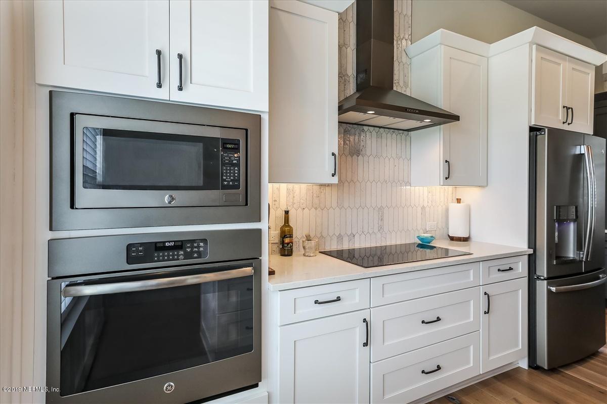80 Ferrol Road St. Augustine, FL 32084 - Photo 9 of 32 a kitchen with cabinets stainless steel appliances and a counter space