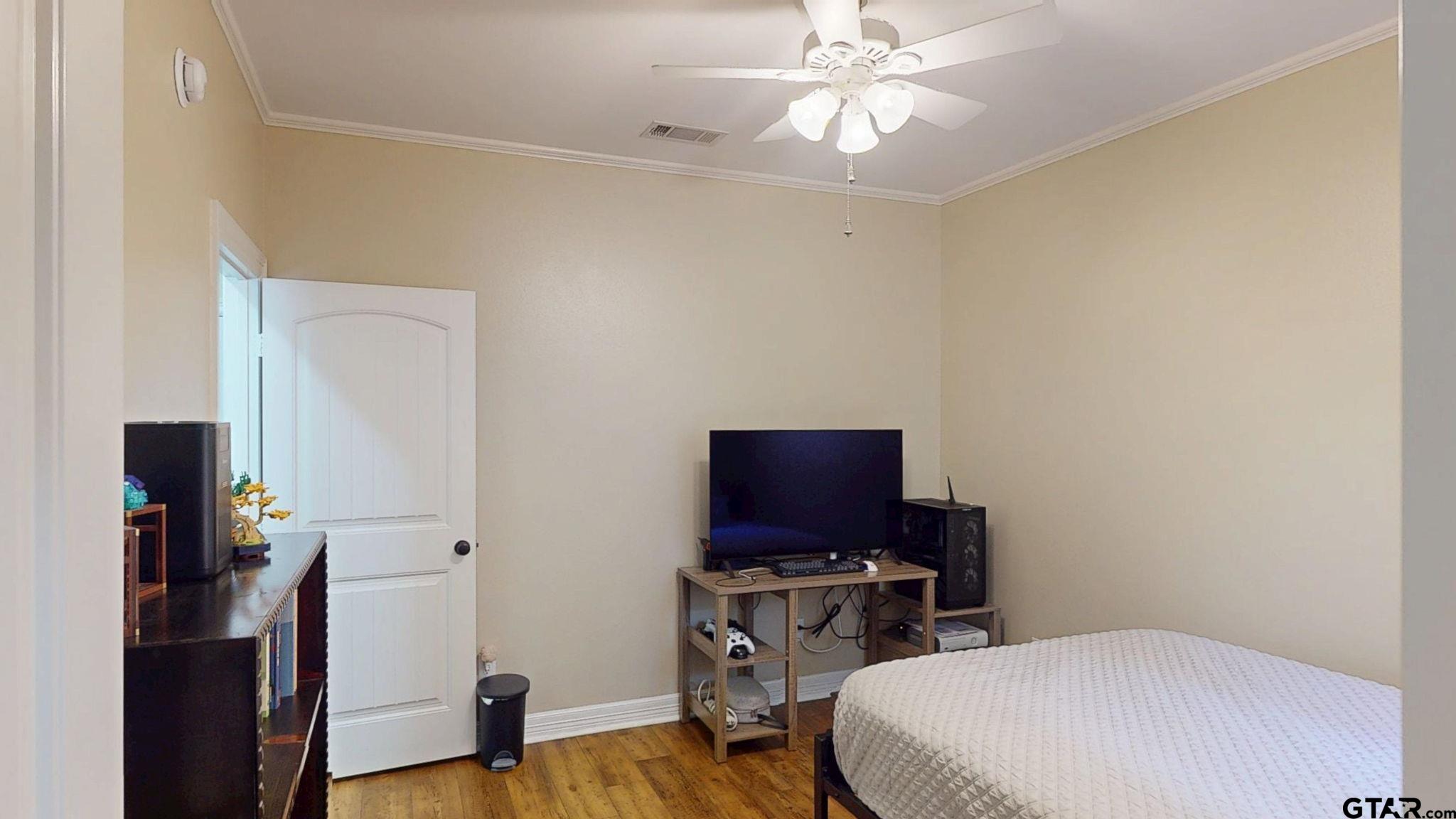 18488 Bluebird Circle Flint, TX 75762 - Photo 34 of 47 a bedroom with a bed and a flat screen tv