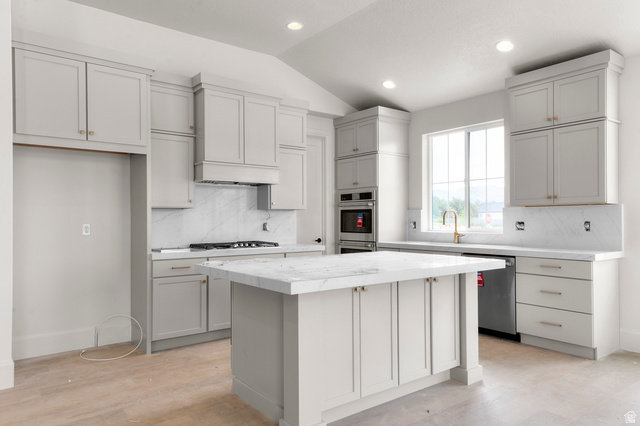 11718 South Halls Crk Road Draper, UT 84020 - Photo 16 of 28 Kitchen featuring light gray cabinetry, a central island with a stone countertop, built-in double ovens, a gas range with a range hood, and recessed lighting