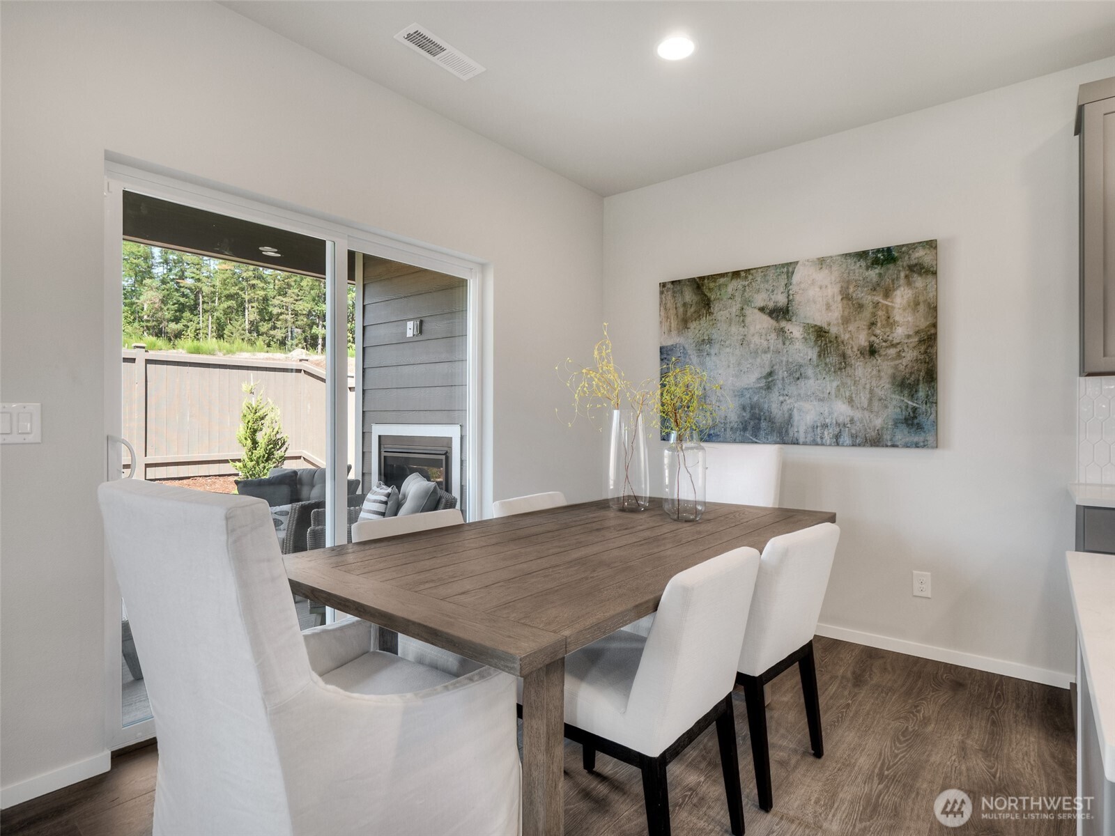 4525 Merlot Street Blaine, WA 98230 - Photo 11 of 32 a view of a dining room with furniture wooden floor and a potted plant
