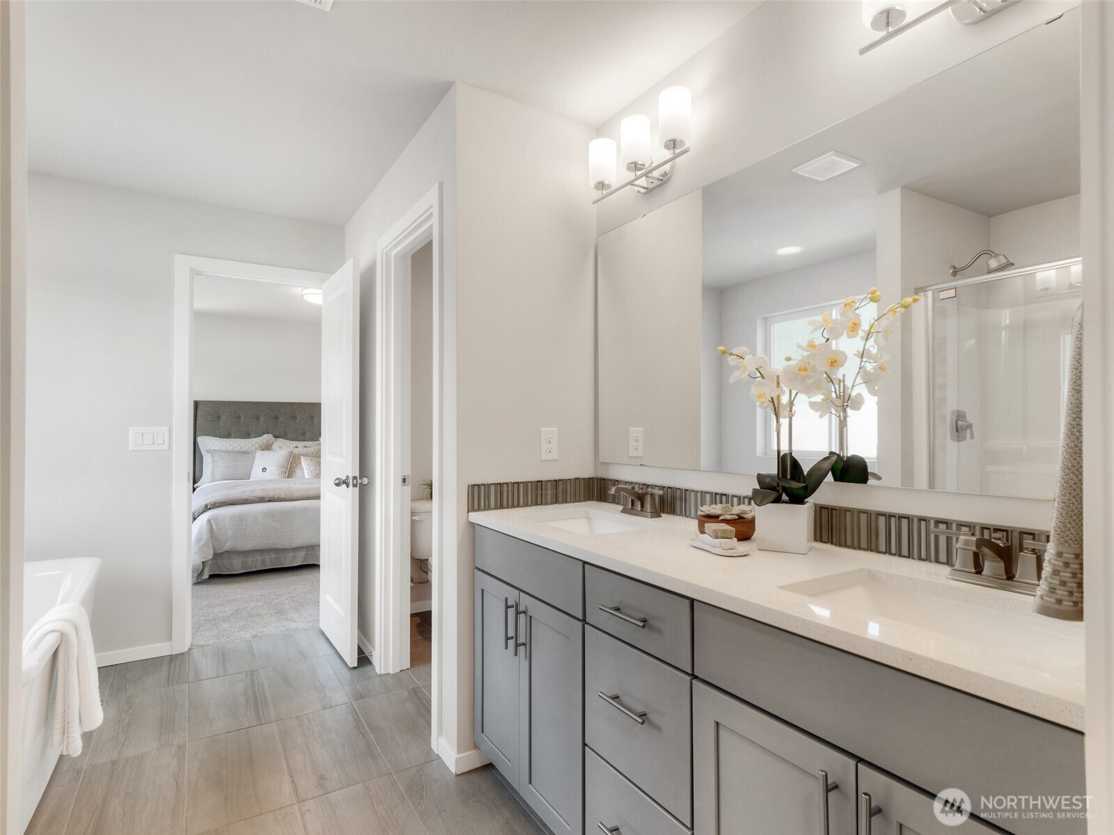 4525 Merlot Street Blaine, WA 98230 - Photo 24 of 32 a spacious bathroom with a sink a mirror and a shower