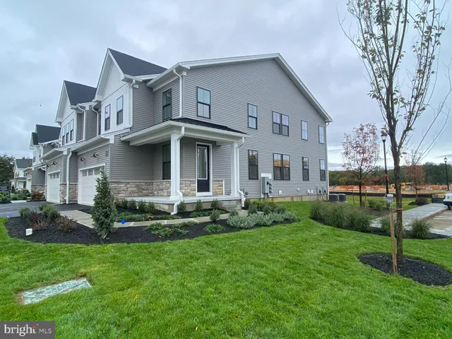 a view of house with a yard