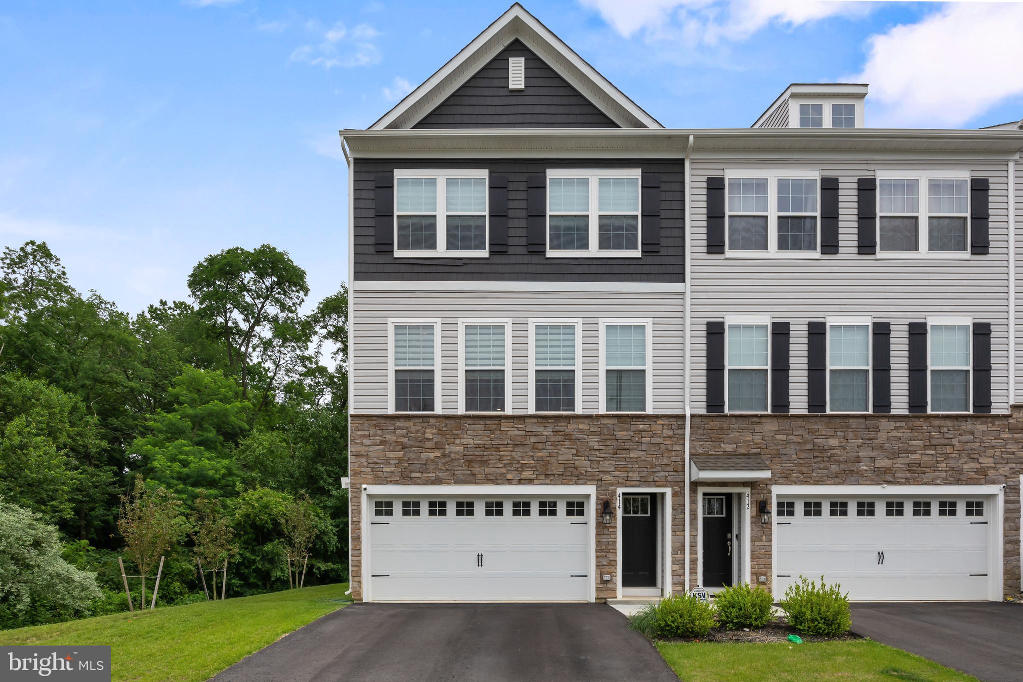 a front view of a building with garden