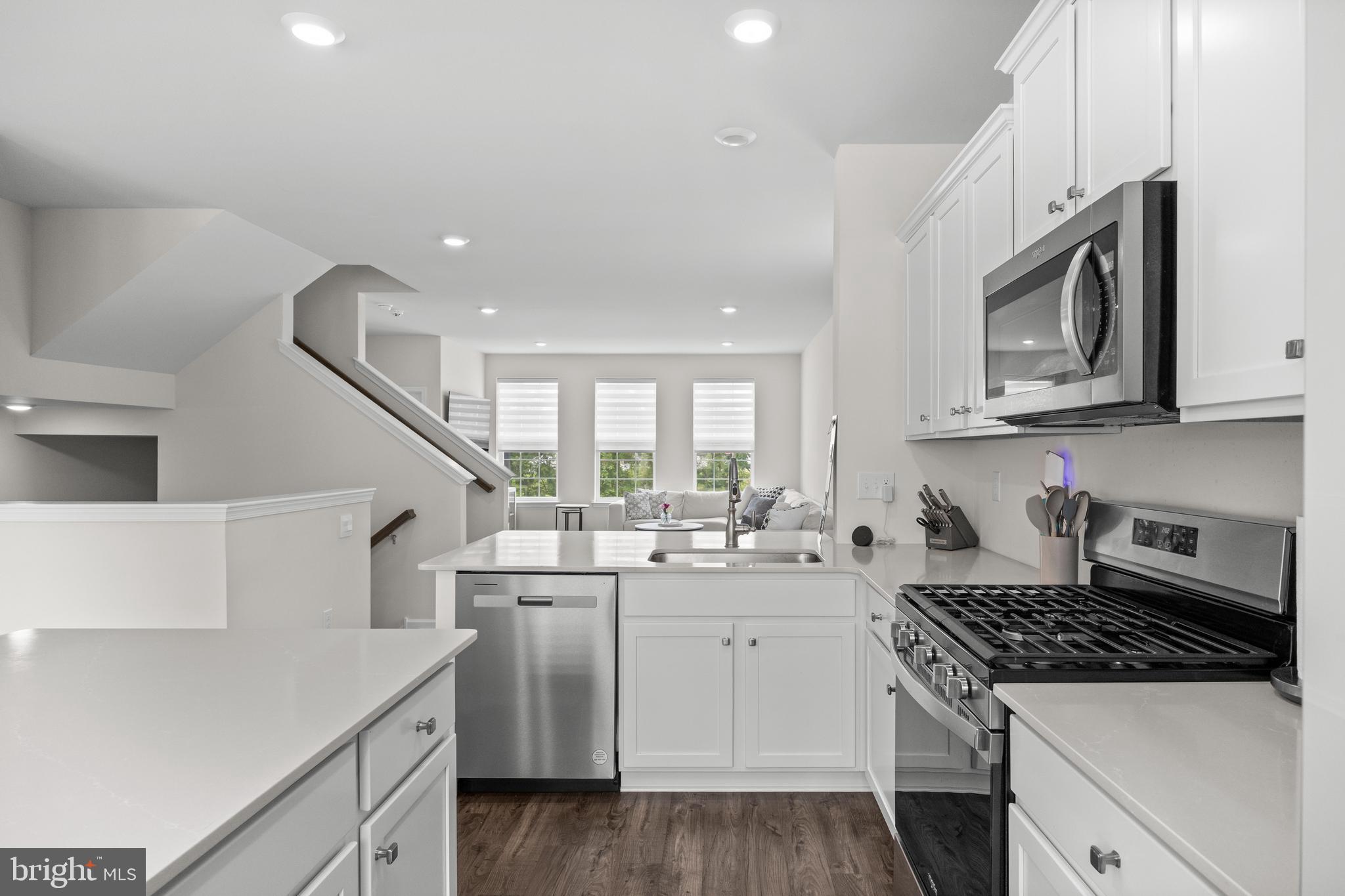 414 Monte Farm Road Mount Laurel, NJ 08054 - Photo 11 of 27 a kitchen with a sink a stove and cabinets