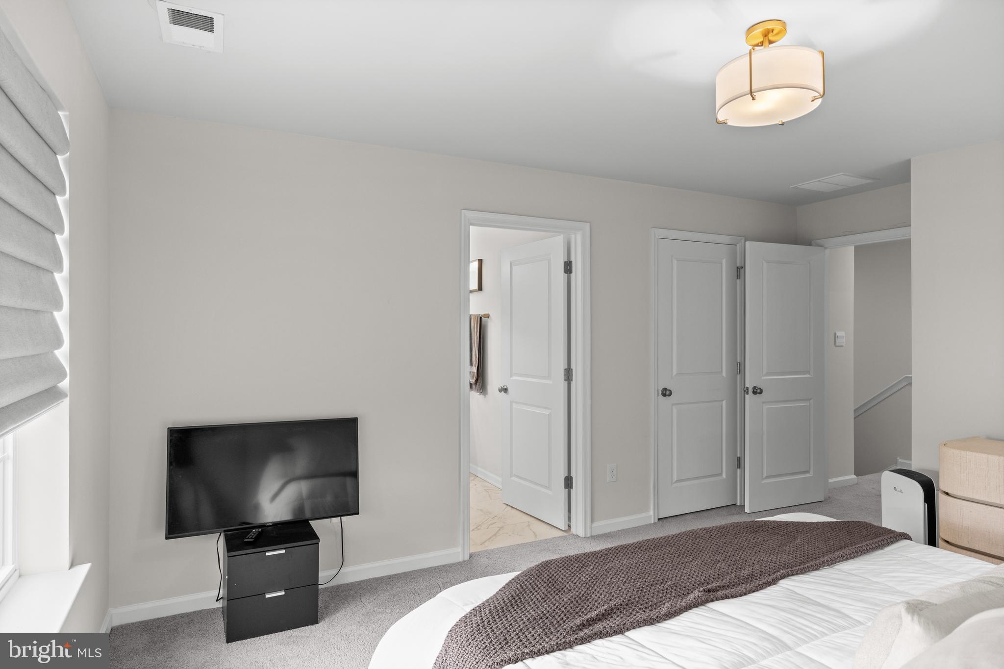 414 Monte Farm Road Mount Laurel, NJ 08054 - Photo 17 of 27 a bedroom with a bed and a television