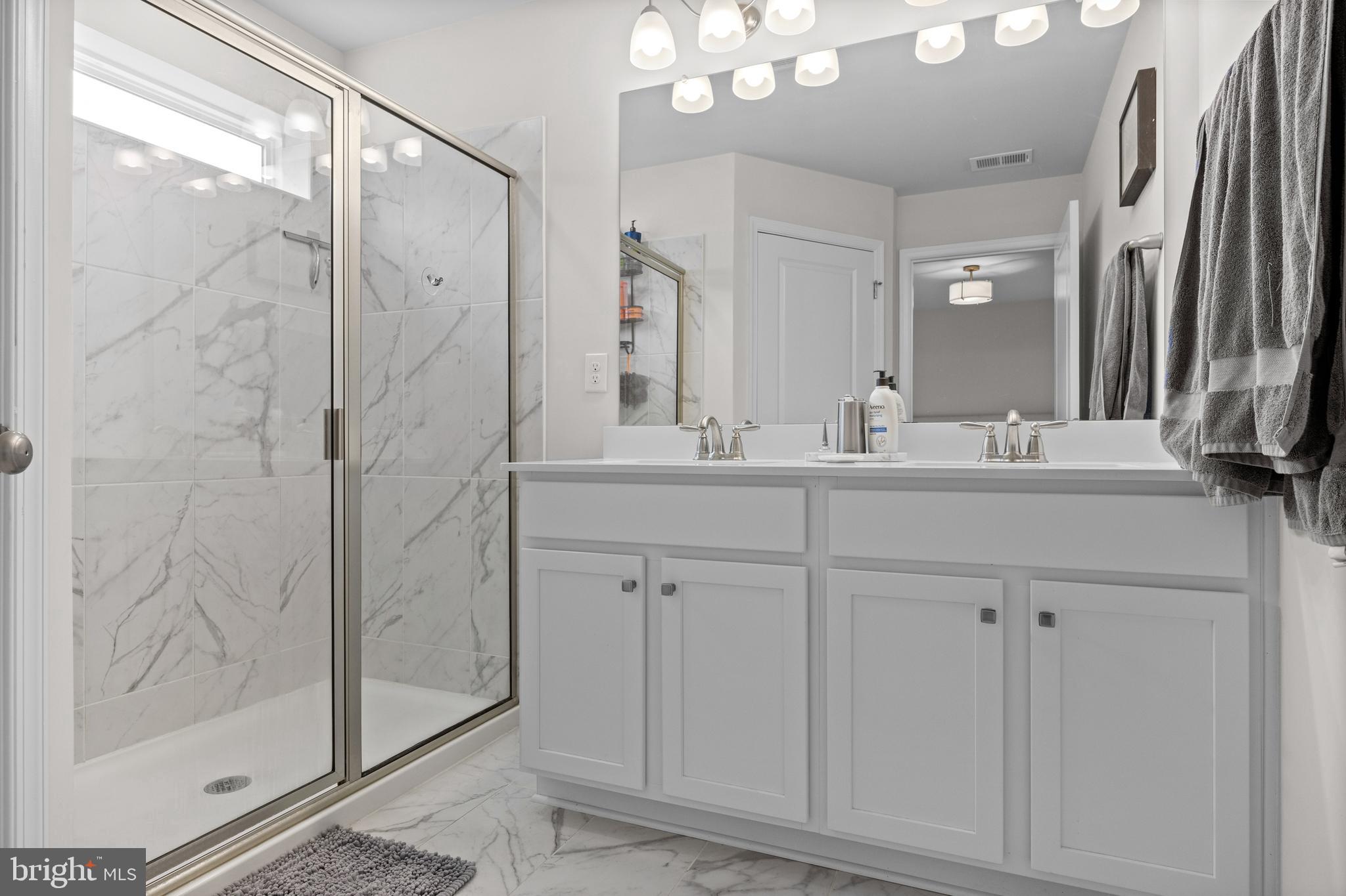 414 Monte Farm Road Mount Laurel, NJ 08054 - Photo 18 of 27 a bathroom with a double vanity sink mirror and shower