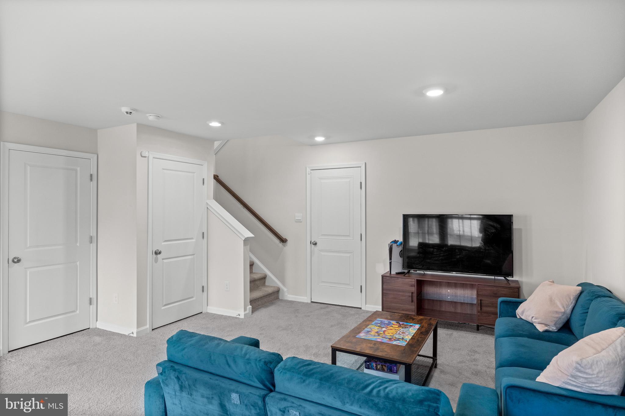 414 Monte Farm Road Mount Laurel, NJ 08054 - Photo 24 of 27 a living room with furniture and a flat screen tv