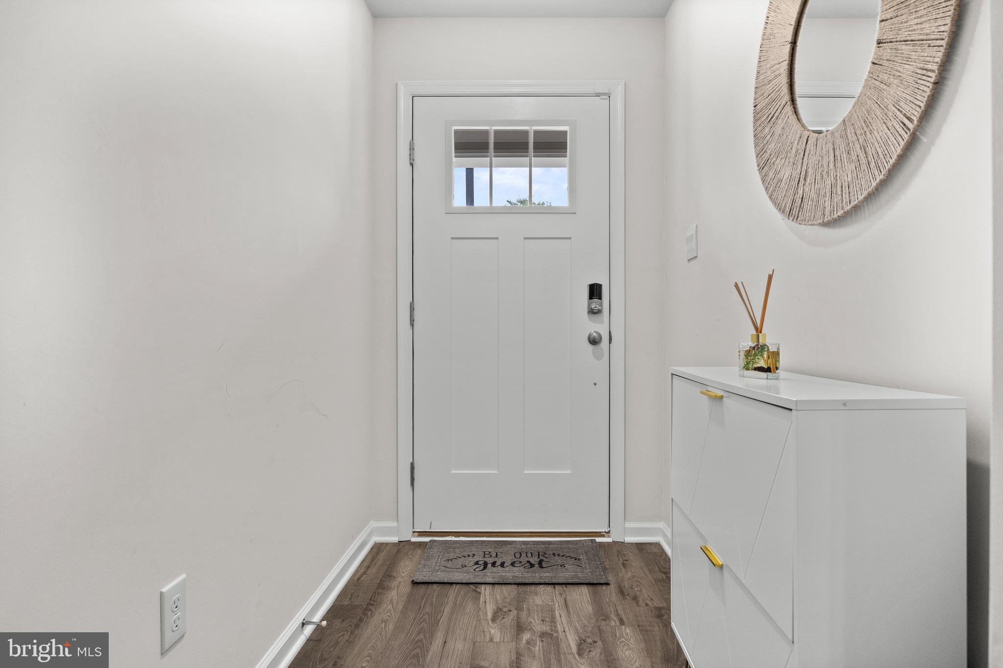 414 Monte Farm Road Mount Laurel, NJ 08054 - Photo 4 of 27 a view of a livingroom with wooden floor and a white door