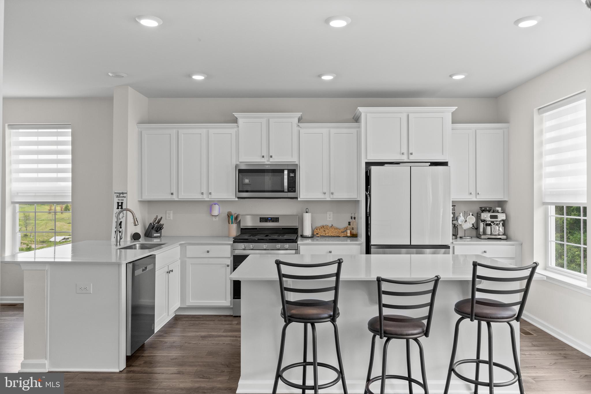 414 Monte Farm Road Mount Laurel, NJ 08054 - Photo 5 of 27 a kitchen with white cabinets and stainless steel appliances