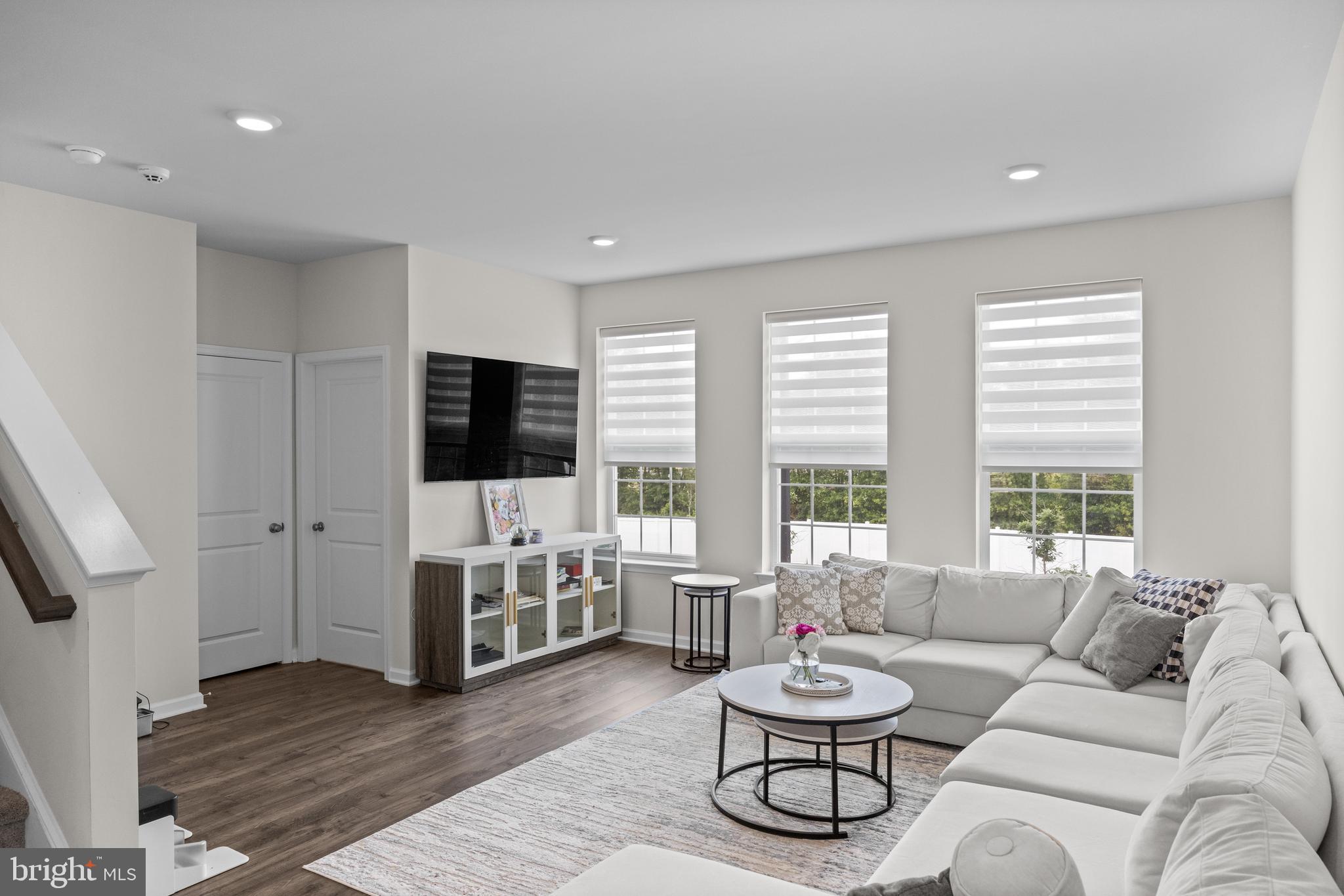414 Monte Farm Road Mount Laurel, NJ 08054 - Photo 7 of 27 a living room with furniture a flat screen tv and a large window