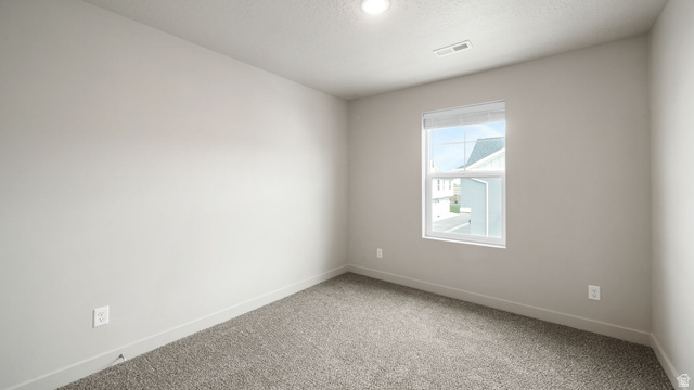1223 East 1775 North Payson, UT 84651 - Photo 39 of 45 Carpeted interior room with neutral-toned walls, recessed ceiling light, and a single window