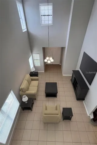 a view of a backyard with table and chairs