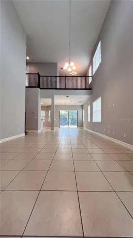 an aerial view of residential houses with outdoor space and parking