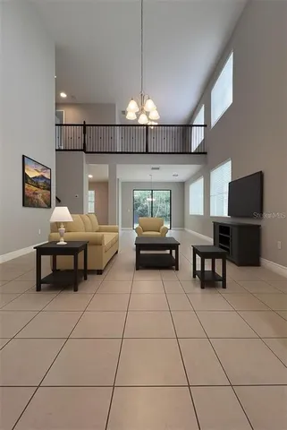 an aerial view of multiple houses with a yard